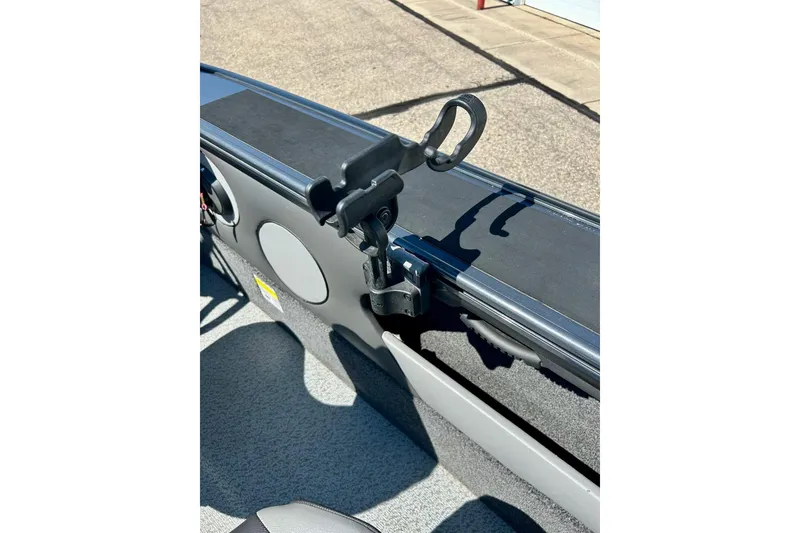 Slide: The Image of 2021 Lund 1875 Crossover XS boat interior with rod holder attachment. - 59