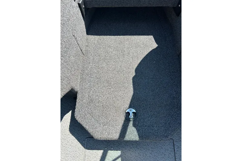 Slide: The Image of 2021 Lund 1875 Crossover XS boat interior with gray carpet flooring. - 61