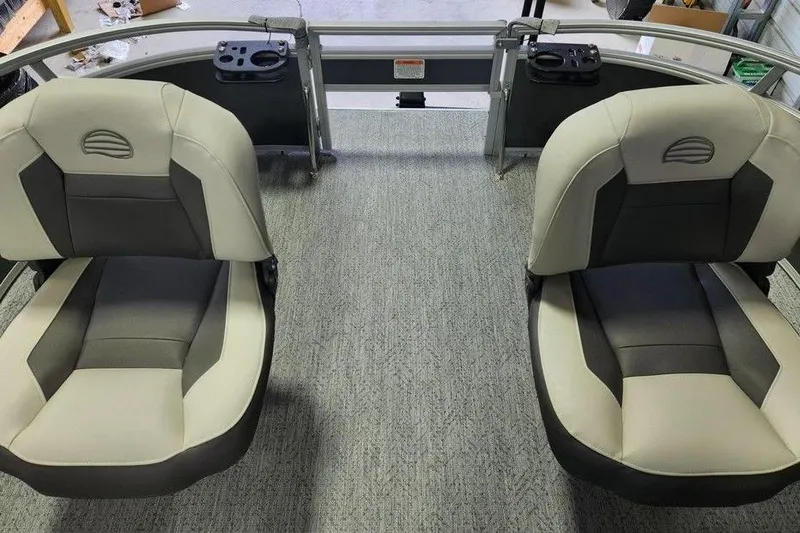 Slide: The Image of 2026 Sun Tracker Bass Buggy 16 XL Select interior with seating and helm station. - 7