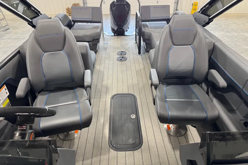 Slide: The Image of Interior of 2025 Manitou 26 Explore boat with modern seating and sleek design. - 11