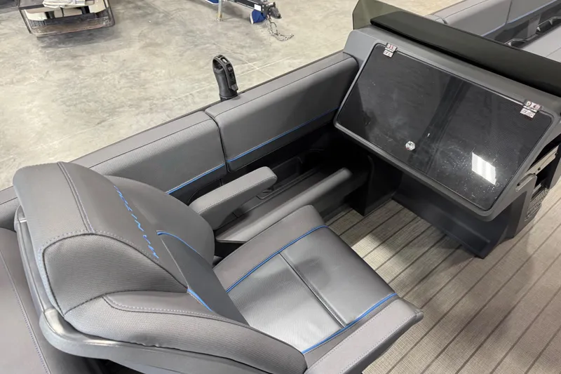 Slide: The Image of 2025 Manitou 26 Explore boat interior with sleek seating and modern dashboard design. - 8