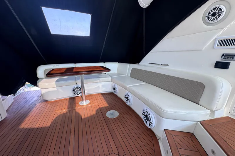 Slide: The Image of Luxurious 2011 Sea Ray 540 Sundancer yacht interior with elegant seating and wooden flooring. - 13