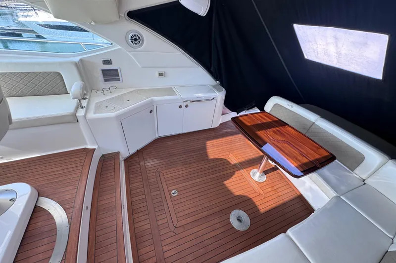 Slide: The Image of Luxurious interior of 2011 Sea Ray 540 Sundancer yacht with wood flooring and seating. - 15