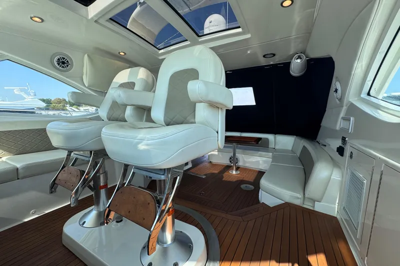 Slide: The Image of Luxurious interior of 2011 Sea Ray 540 Sundancer yacht with plush seating and wood flooring. - 22