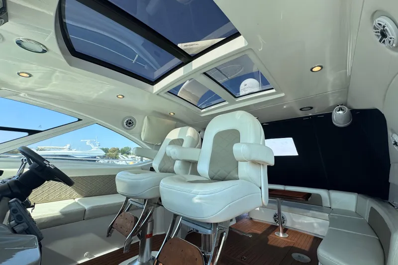 Slide: The Image of Interior of 2011 Sea Ray 540 Sundancer yacht with luxurious seating and skylights. - 23