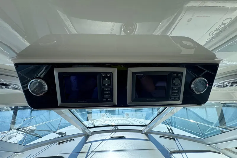 Slide: The Image of Control panel of 2011 Sea Ray 540 Sundancer yacht with navigation screens and gauges. - 28