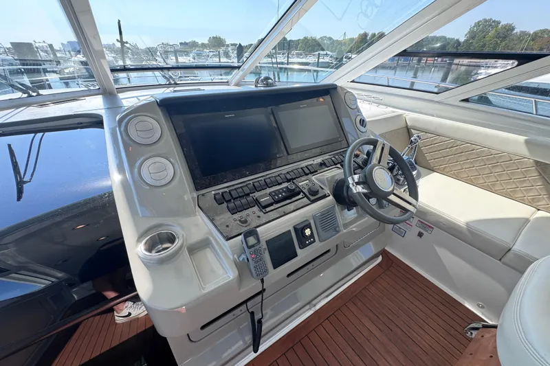 Slide: The Image of Helm of 2011 Sea Ray 540 Sundancer yacht with modern controls and navigation systems. - 30