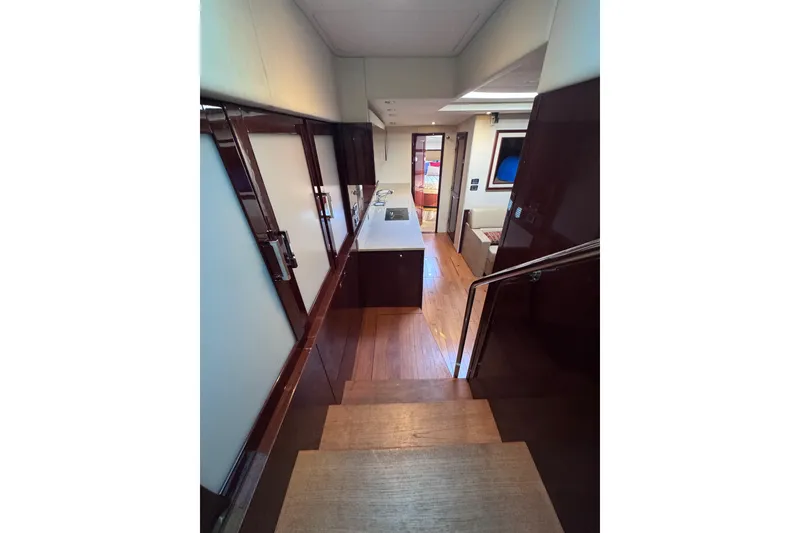 Slide: The Image of Interior view of 2011 Sea Ray 540 Sundancer yacht, featuring elegant wood finishes and modern design. - 36