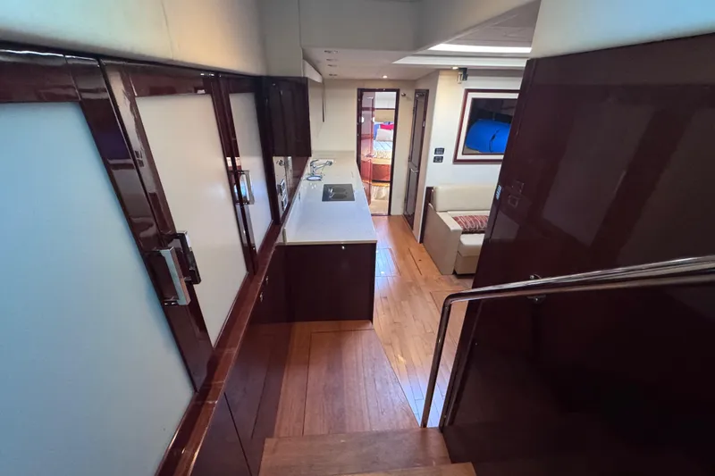 Slide: The Image of Luxurious interior of 2011 Sea Ray 540 Sundancer yacht with modern kitchen and seating area. - 37