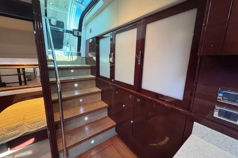 Slide: The Image of Luxurious interior of 2011 Sea Ray 540 Sundancer yacht with elegant wood finishes. - 40
