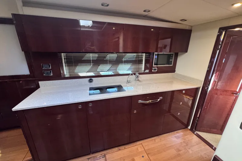 Slide: The Image of Luxurious kitchen interior of 2011 Sea Ray 540 Sundancer yacht with modern amenities. - 45