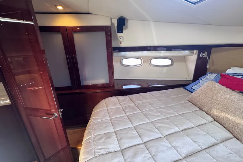 Slide: The Image of Luxurious cabin interior of 2011 Sea Ray 540 Sundancer yacht with cozy bedding. - 50
