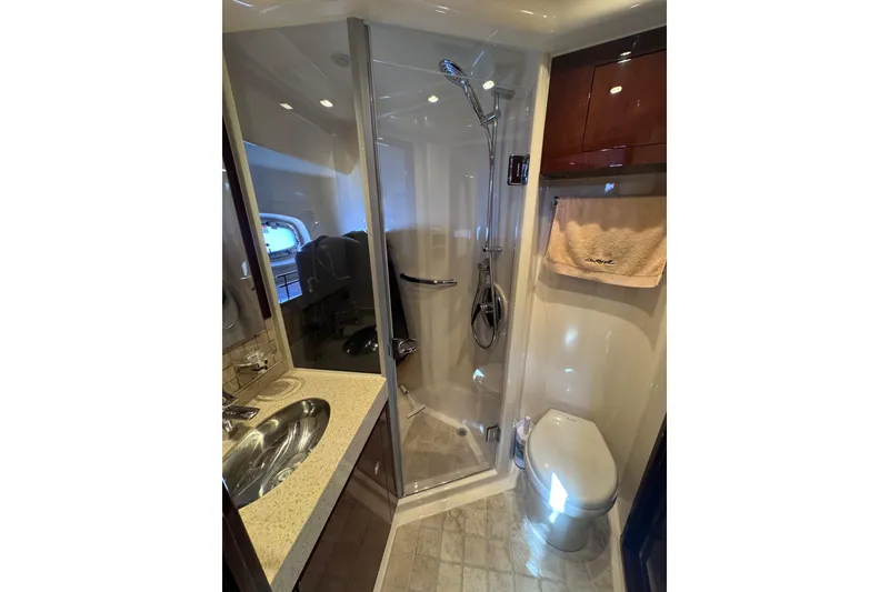 Slide: The Image of Luxurious bathroom in 2011 Sea Ray 540 Sundancer yacht with shower, sink, and toilet. - 53