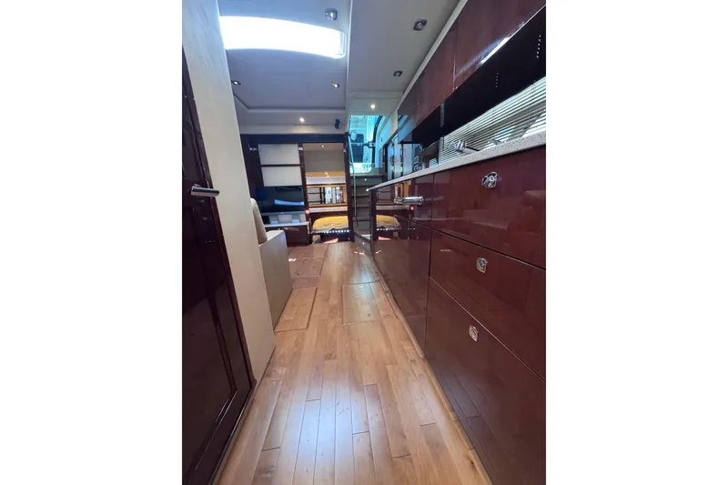 Slide: The Image of Luxurious interior of 2011 Sea Ray 540 Sundancer yacht with wooden flooring. - 56