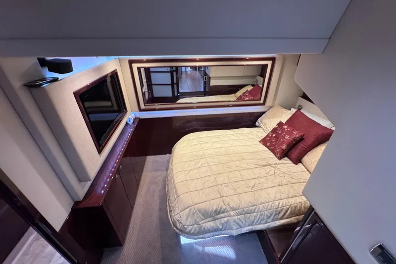 Slide: The Image of Luxurious bedroom interior of 2011 Sea Ray 540 Sundancer yacht with elegant bedding and TV. - 60