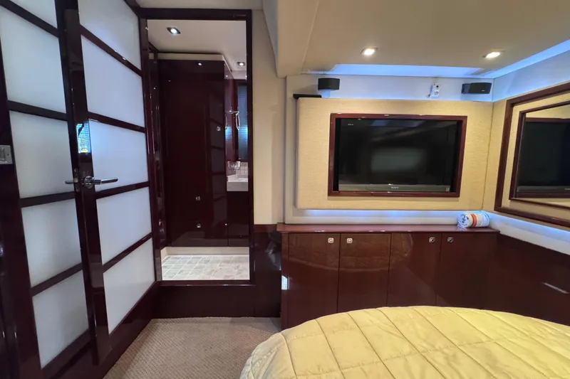 Slide: The Image of Luxurious interior of 2011 Sea Ray 540 Sundancer yacht with TV and elegant furnishings. - 62
