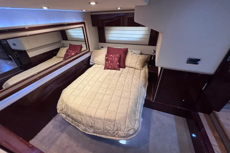 Slide: The Image of Luxurious bedroom interior of 2011 Sea Ray 540 Sundancer yacht with elegant bedding. - 63