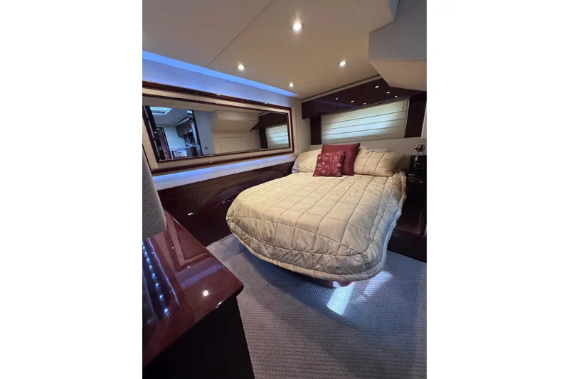 Slide: The Image of Luxurious bedroom interior of 2011 Sea Ray 540 Sundancer yacht with elegant bedding. - 64