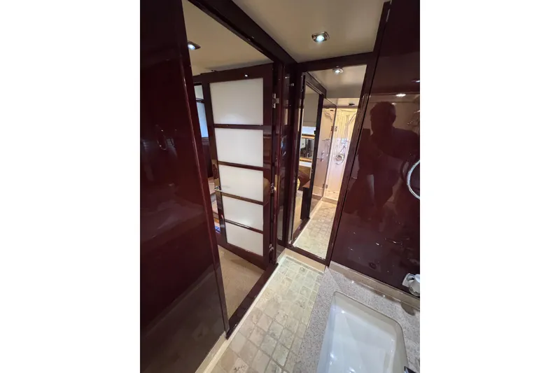 Slide: The Image of Interior of 2011 Sea Ray 540 Sundancer yacht, featuring elegant wood finishes and modern design. - 69