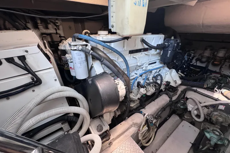 Slide: The Image of Engine room of 2011 Sea Ray 540 Sundancer yacht, showcasing mechanical components. - 76