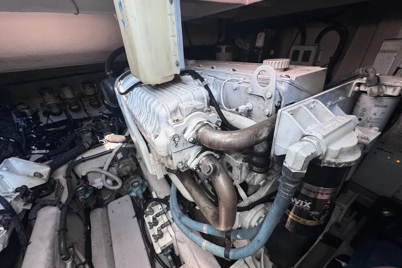 Slide: The Image of Engine room of 2011 Sea Ray 540 Sundancer yacht, showcasing mechanical components and systems. - 77