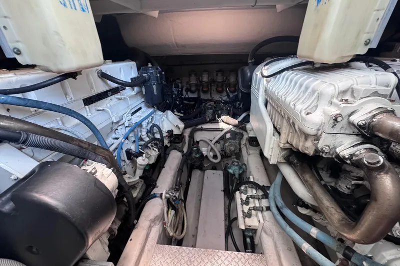 Slide: The Image of Engine room of a 2011 Sea Ray 540 Sundancer yacht, showcasing mechanical components. - 78
