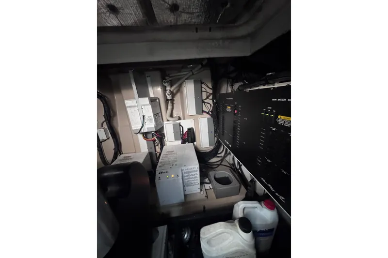 Slide: The Image of Engine room of 2011 Sea Ray 540 Sundancer with electrical panels and wiring. - 79