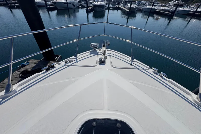 Slide: The Image of Bow view of 2011 Sea Ray 540 Sundancer yacht docked in marina. - 9