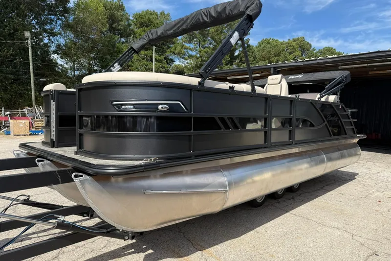 The Image of 2026 Bentley Pontoons Elite 223 QSB pontoon boat with sleek black design and spacious seating. - 0