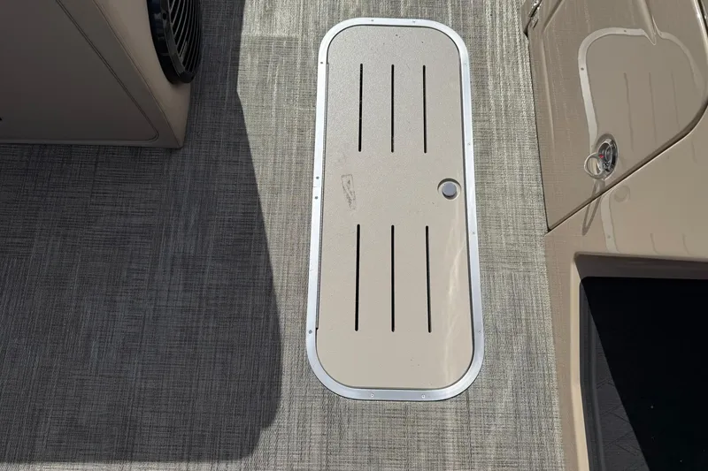 Slide: The Image of 2026 Bentley Pontoons Elite 223 QSB deck with textured flooring and storage hatch. - 10