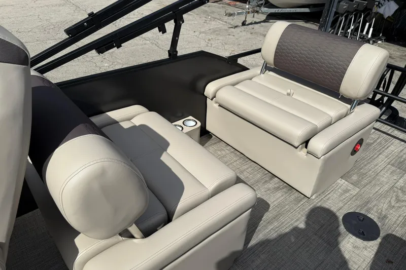 Slide: The Image of 2026 Bentley Pontoons Elite 223 QSB interior with luxurious beige seating and cup holders. - 11