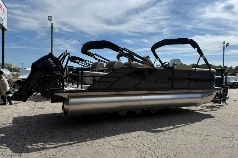 Slide: The Image of 2026 Bentley Pontoons Elite 223 QSB pontoon boat with Suzuki outboard motor, parked outdoors. - 3