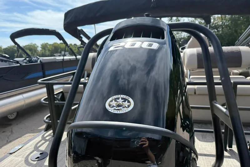 Slide: The Image of 2026 Bentley Pontoons Elite 223 QSB with powerful 200 HP engine, docked outdoors. - 4