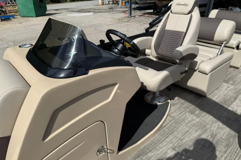 Slide: The Image of 2026 Bentley Pontoons Elite 223 QSB interior with luxurious seating and modern dashboard. - 5