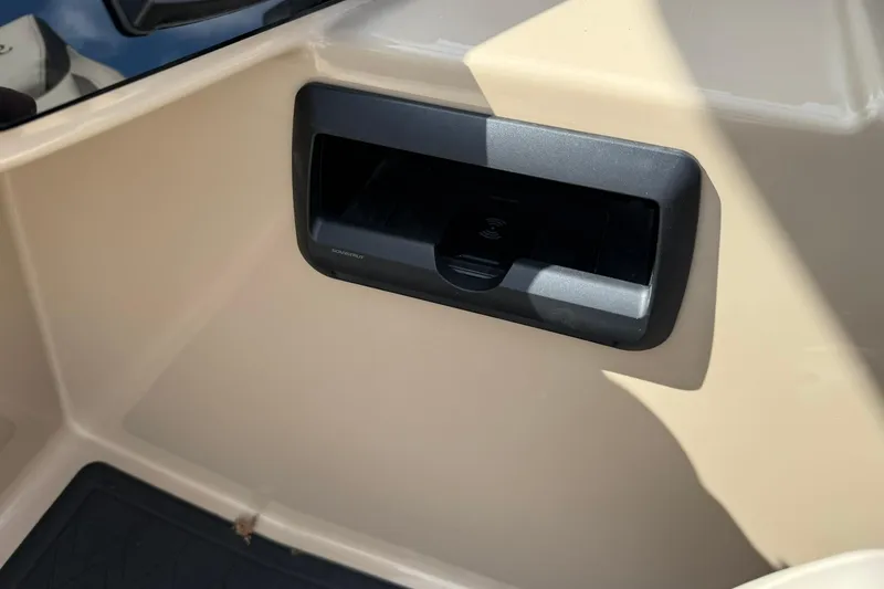 Slide: The Image of 2026 Bentley Pontoons Elite 223 QSB interior detail with built-in storage compartment. - 7