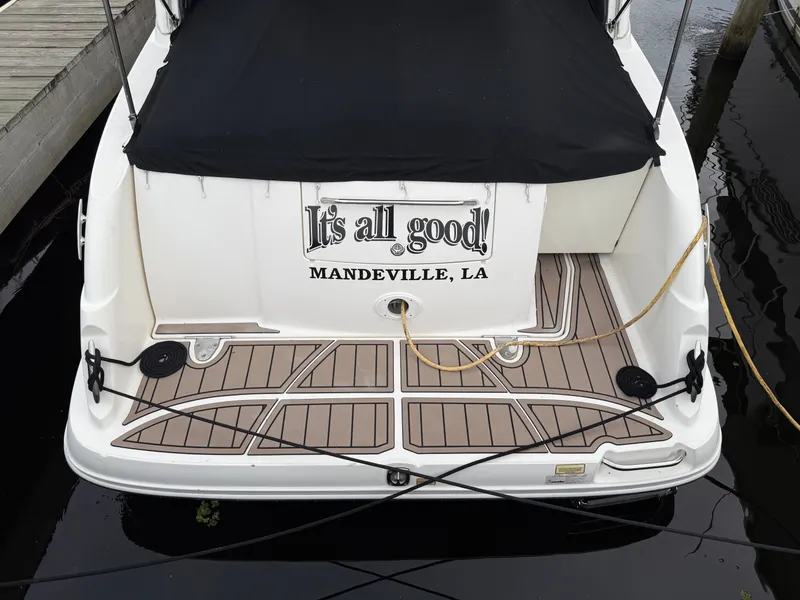 Slide: The Image of 2006 Sea Ray 290 Sundancer boat docked, rear view with "It's all good!" text. - 3