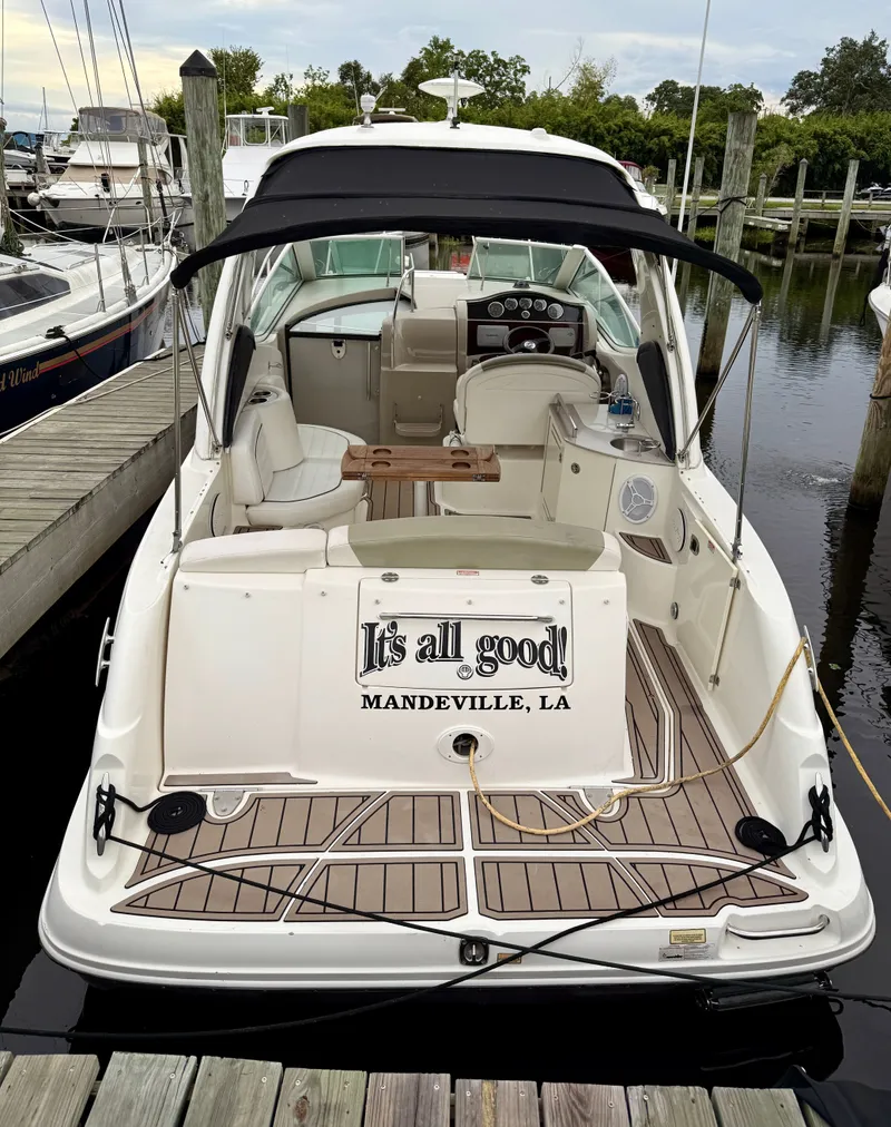 Slide: The Image of 2006 Sea Ray 290 Sundancer docked, rear view, with "It's all good!" text, Mandeville, LA. - 4