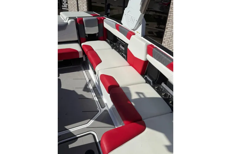 Slide: The Image of 2021 Malibu M240 boat interior with red and white seating, showcasing modern design. - 10