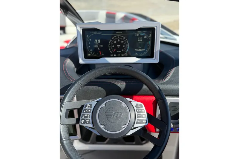 Slide: The Image of 2021 Malibu M240 dashboard with steering wheel and digital display. - 13