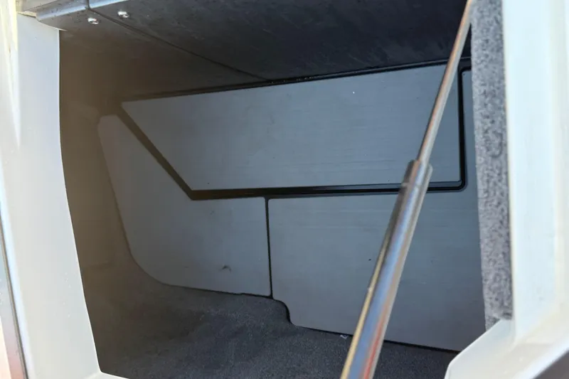 Slide: The Image of Storage compartment of a 2021 Malibu M240 boat, featuring a sleek interior design. - 15