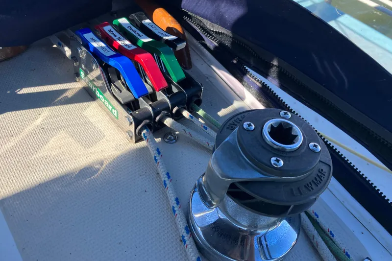 Slide: The Image of Sailing controls and winch on a 1985 Catalina 30 yacht deck. - 19