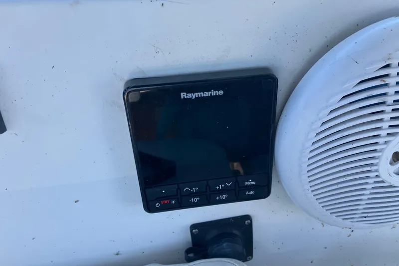 Slide: The Image of Raymarine control panel and speaker on 1985 Catalina 30 boat. - 12
