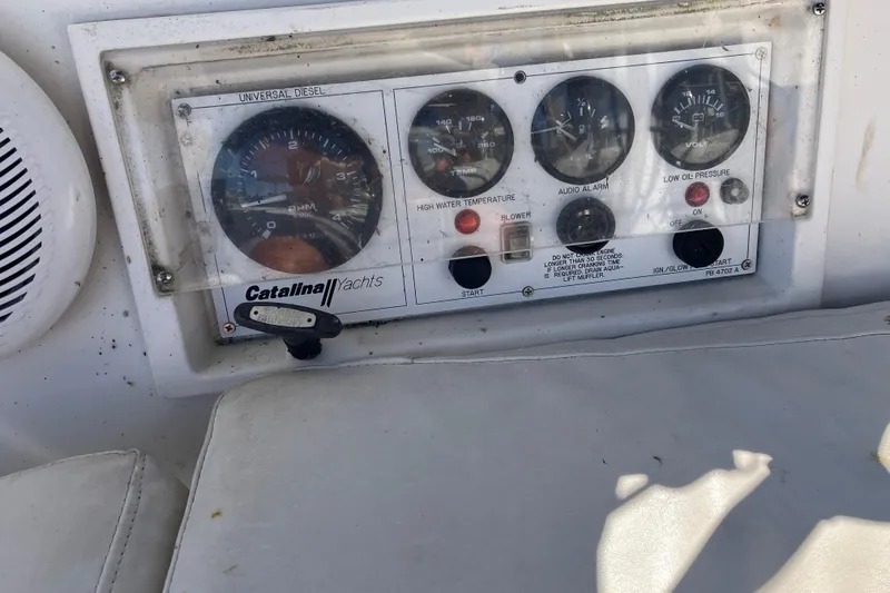 Slide: The Image of Control panel of a 1985 Catalina 30 yacht with gauges and switches. - 6