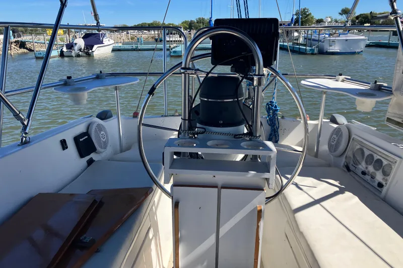 Slide: The Image of Cockpit of a 1985 Catalina 30 sailboat docked at a marina. - 5