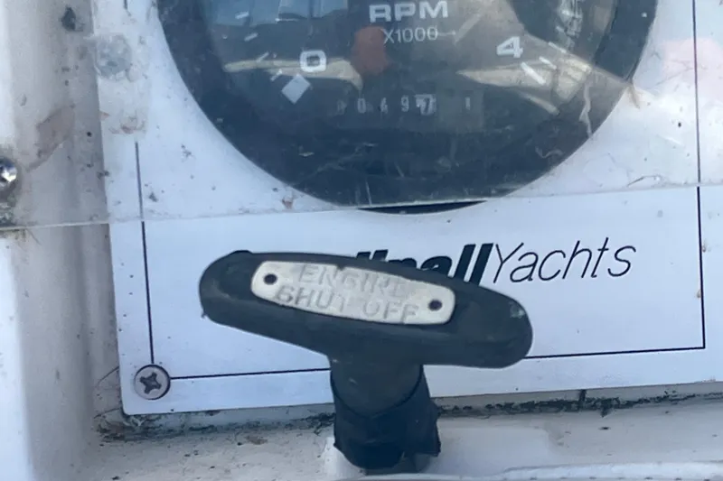 Slide: The Image of Engine shut-off switch and RPM gauge on 1985 Catalina 30 yacht dashboard. - 9