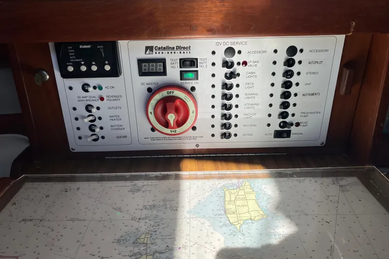 Slide: The Image of Control panel of a 1985 Catalina 30 sailboat with navigation chart. - 30