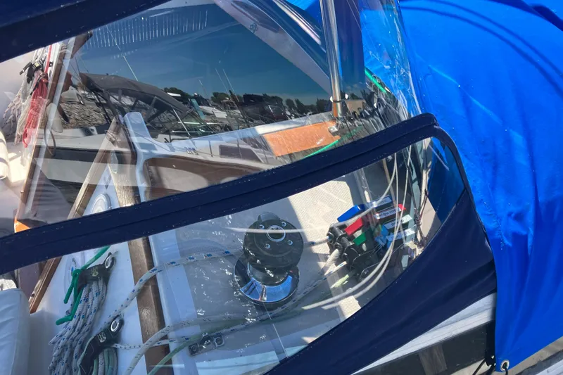Slide: The Image of Cockpit of a 1985 Catalina 30 sailboat with blue cover and winch. - 36