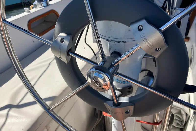Slide: The Image of Steering wheel of a 1985 Catalina 30 sailboat, featuring a modern design. - 11