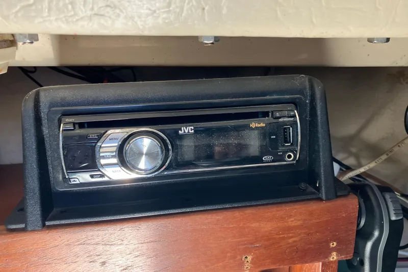 Slide: The Image of JVC car stereo installed in a 1985 Catalina 30 boat, featuring HD Radio and USB port. - 24