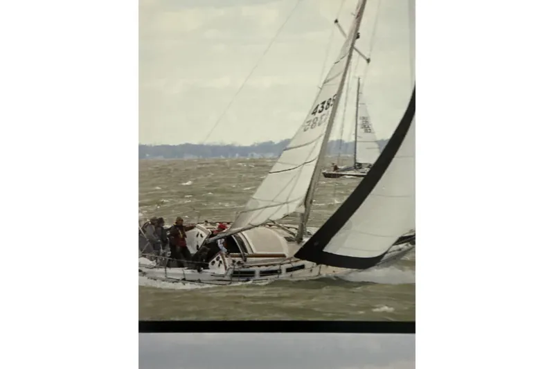 Slide: The Image of Sailing on a 1986 Catalina 30 yacht in choppy waters, showcasing its classic design. - 44